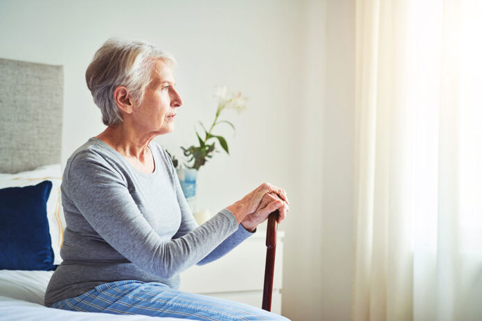 elderly woman with a cane