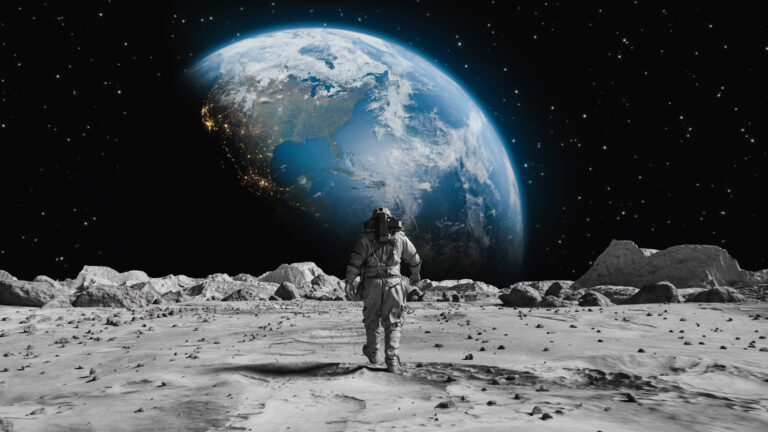 Following Shot of Brave Astronaut in Space Suit Confidently Walking on Moon Towards Earth. Covered in Rocks. First Astronaut On the Moon Surface. Big Moment for the Human Race. Advanced Technologies, Space Exploration/ Travel, Colonization Concept.