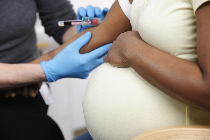 Close-up Of Pregnant African American Woman Having Blood Taken for NIPT